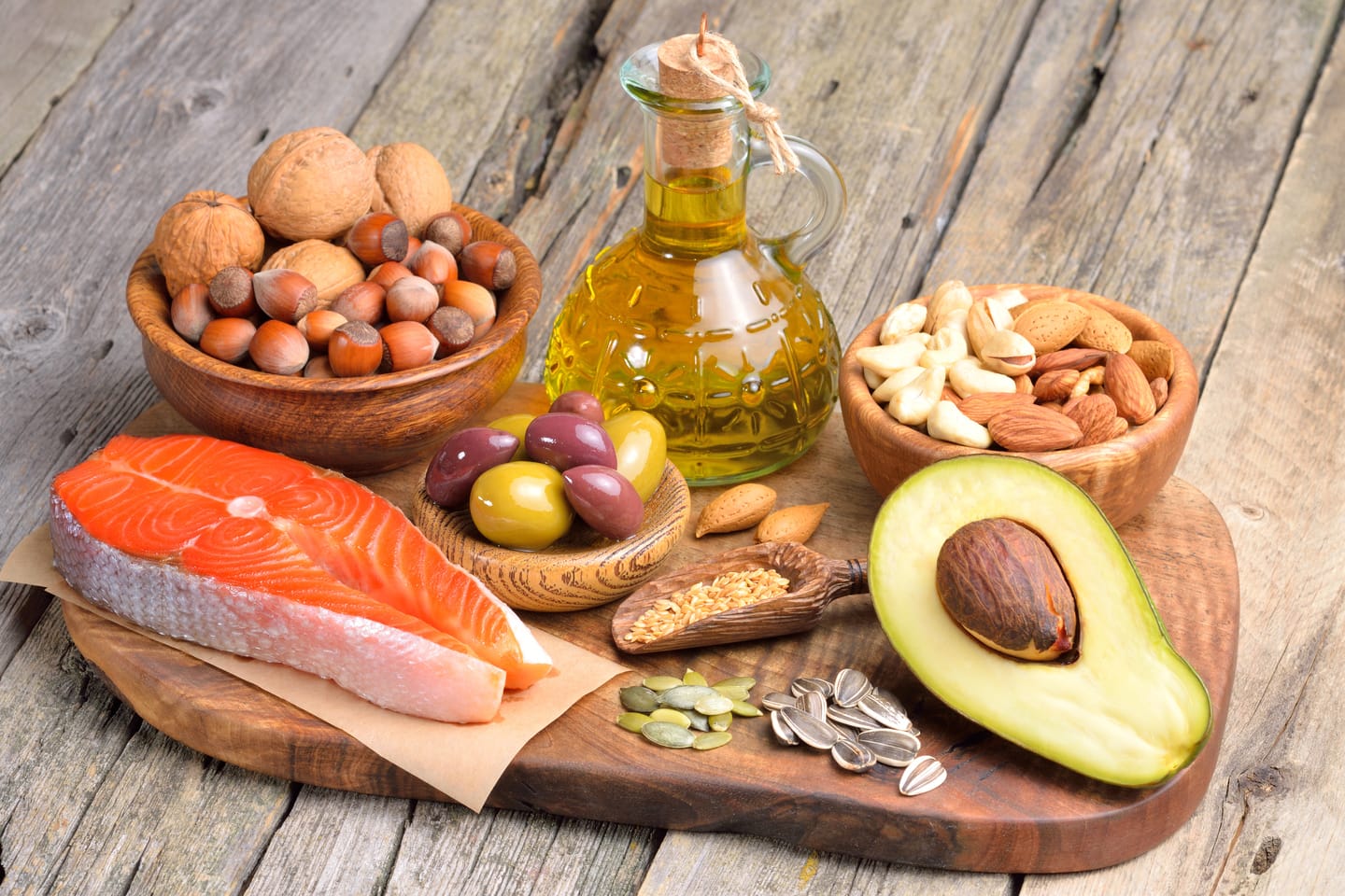 Selection,of,healthy,fat,sources,on,wooden,background.